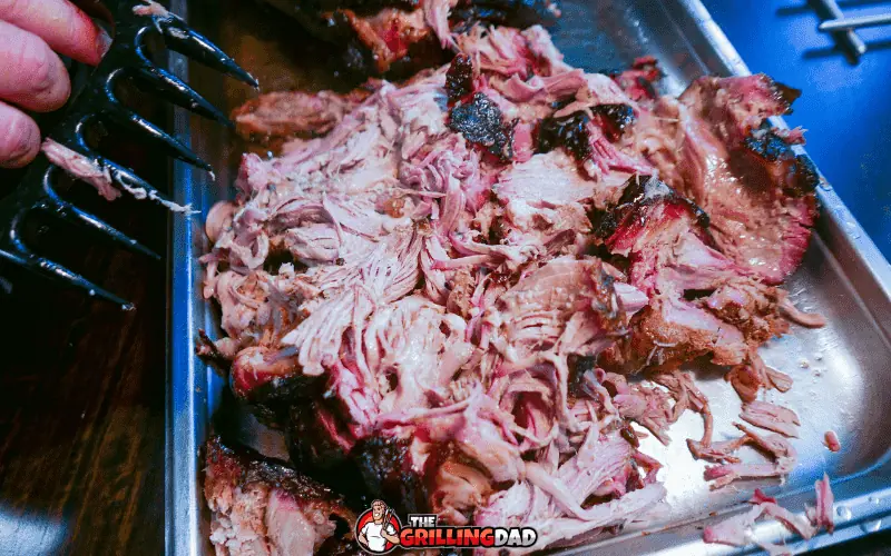 using claws to pull pork shoulder