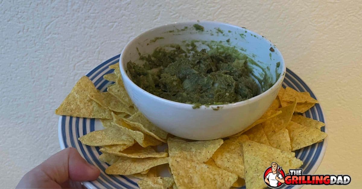 smoked guac in a bowl with chips